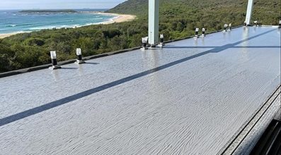Flat Roof Waterproofing with a Beach View — Internal Waterproofing in Killarney Vale, NSW